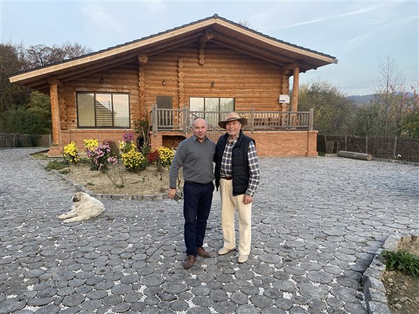 In front of a completed log house